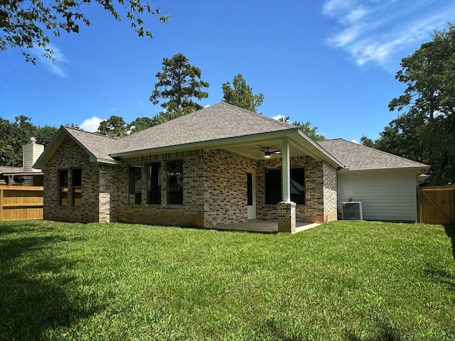 rear view of property with brick siding, central AC unit, a patio area, ceiling fan, and fence