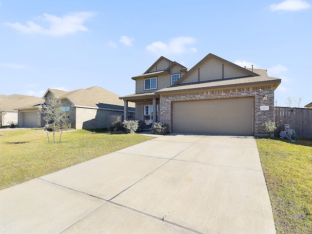 view of front of home with a garage, driveway, a front lawn, and brick siding