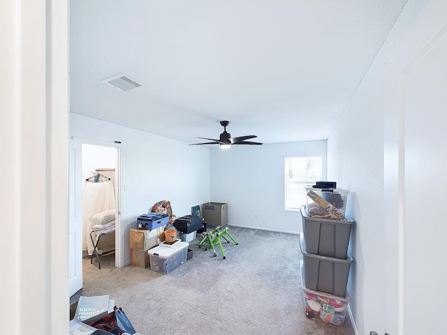 miscellaneous room featuring carpet flooring, visible vents, and a ceiling fan