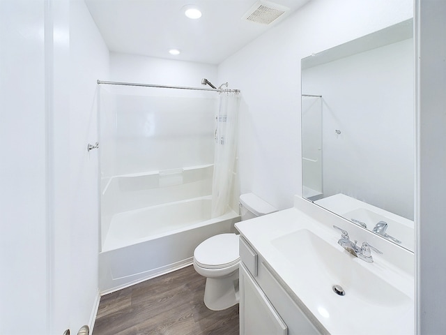 full bath featuring toilet, wood finished floors, vanity, visible vents, and shower / bathtub combination with curtain