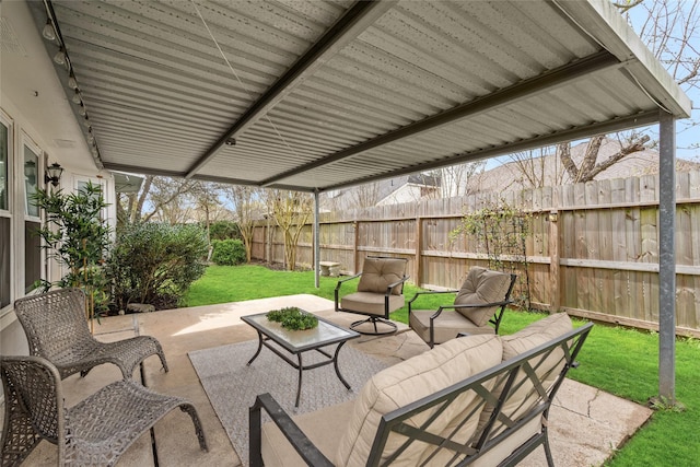 view of patio / terrace featuring a fenced backyard and an outdoor living space