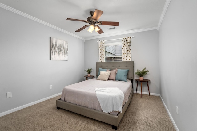 carpeted bedroom featuring visible vents, crown molding, baseboards, and ceiling fan