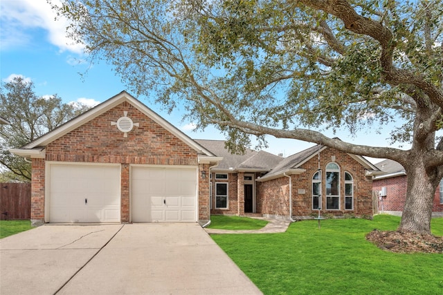 ranch-style home featuring a garage, concrete driveway, a front lawn, and brick siding