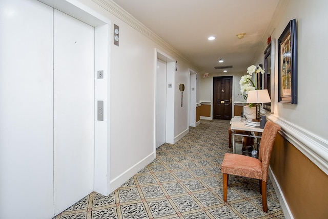 corridor featuring elevator, baseboards, crown molding, and recessed lighting