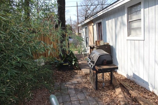 exterior space featuring fence and grilling area