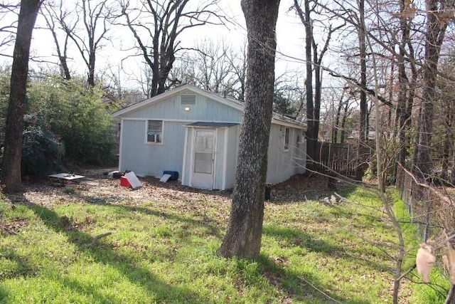 view of outbuilding with an outbuilding and fence