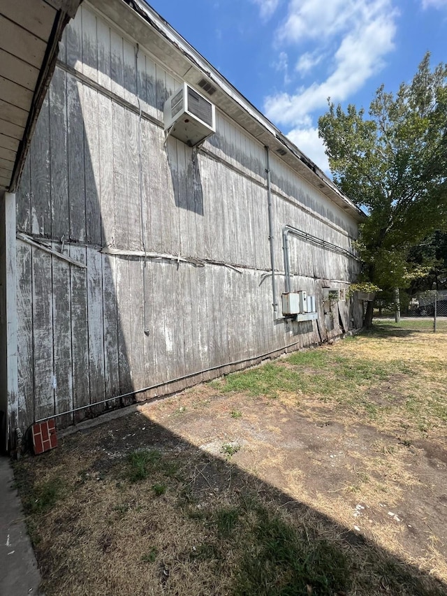 view of property exterior with a barn and an outdoor structure