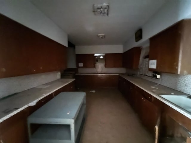 kitchen with light countertops and a sink