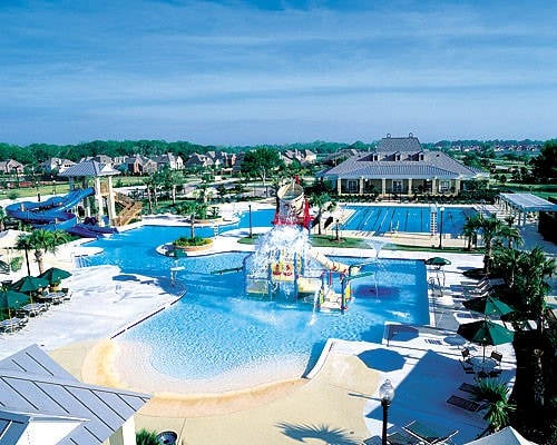 pool featuring a water slide and a water play area