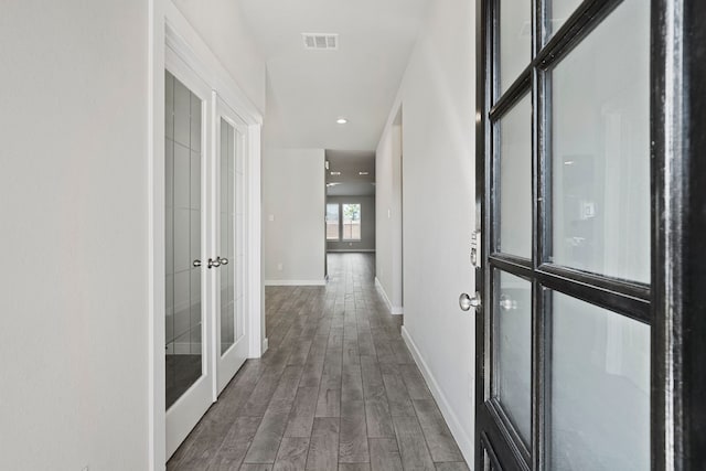 hall with french doors, recessed lighting, visible vents, wood finished floors, and baseboards