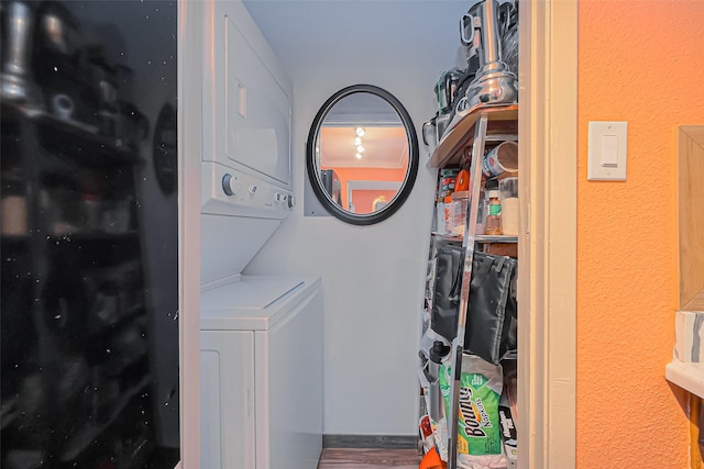 laundry room with laundry area and stacked washer and clothes dryer