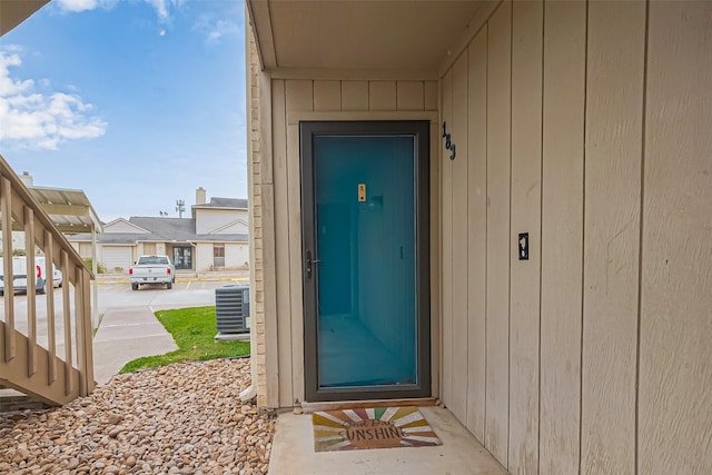 entrance to property featuring central air condition unit