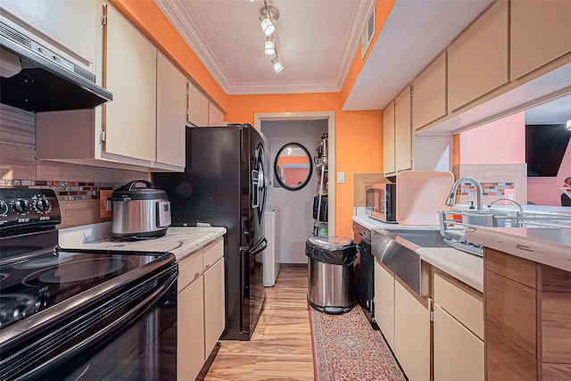 kitchen with light countertops, ornamental molding, ventilation hood, backsplash, and black appliances