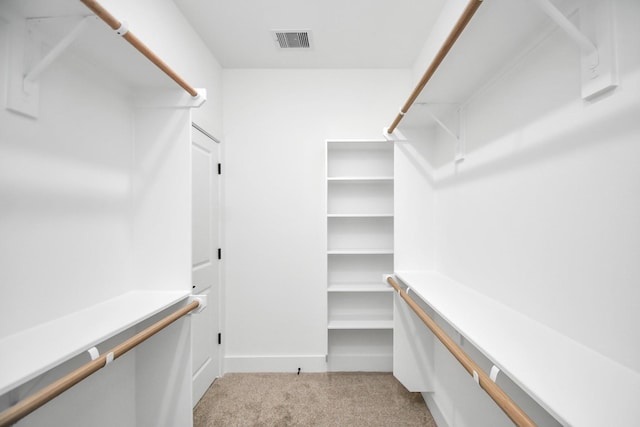 walk in closet with carpet and visible vents