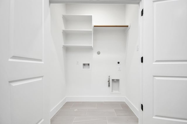 clothes washing area with hookup for a gas dryer, hookup for a washing machine, baseboards, and electric dryer hookup