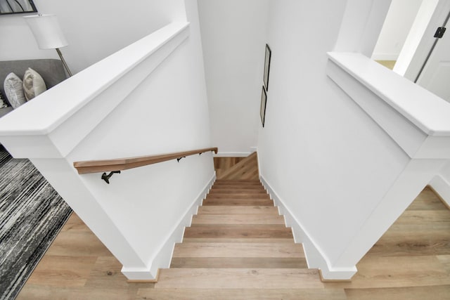 stairs with wood finished floors