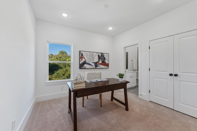 office area with recessed lighting, light colored carpet, and baseboards