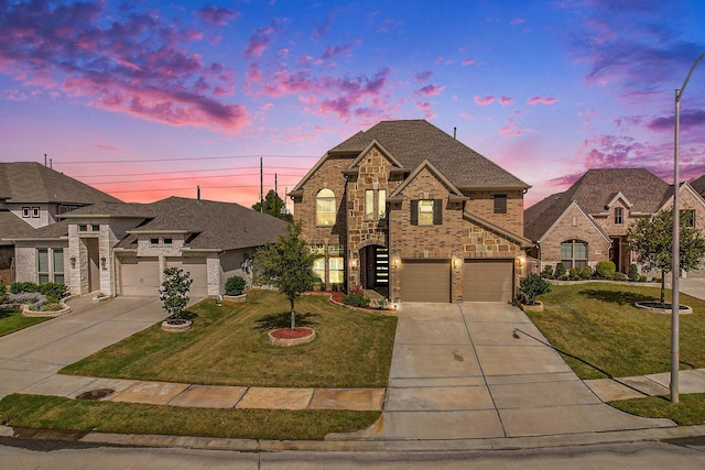 french country home with concrete driveway, brick siding, a front lawn, and stairs