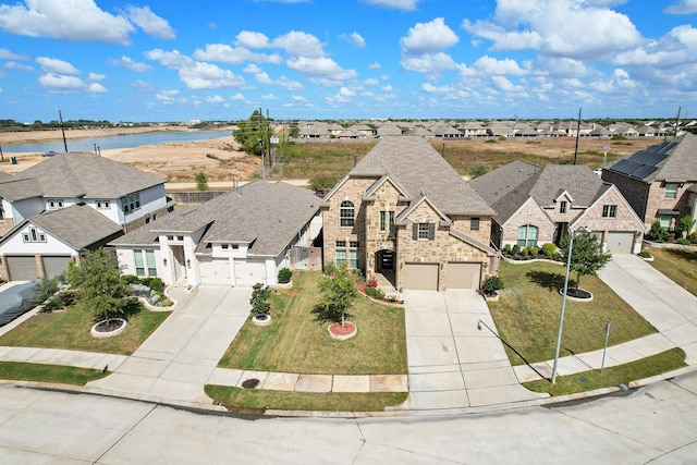 aerial view with a water view and a residential view