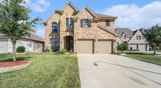 view of front of house featuring stone siding, a front lawn, concrete driveway, and brick siding