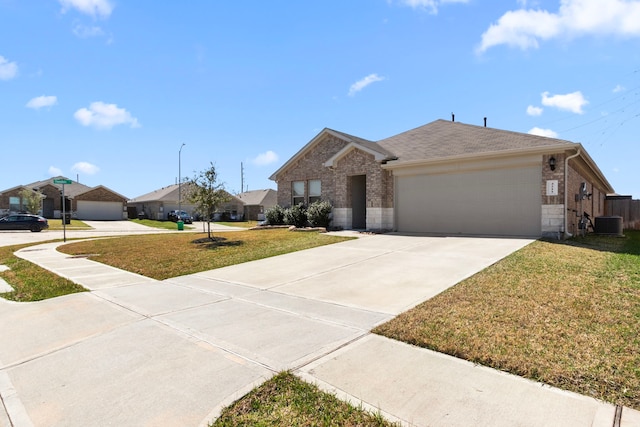 single story home with brick siding, central AC, a garage, driveway, and a front lawn