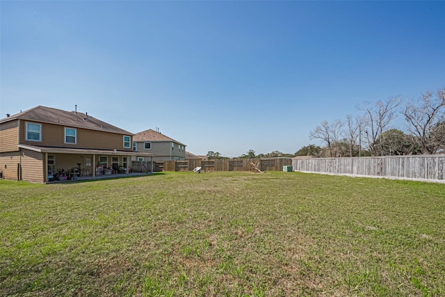 view of yard featuring a patio area and a fenced backyard