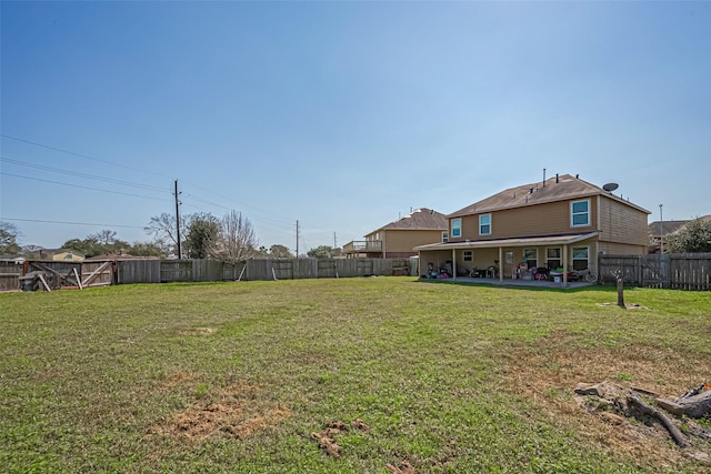 view of yard with a patio area and a fenced backyard