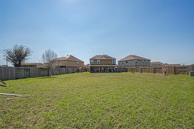 view of yard with a fenced backyard