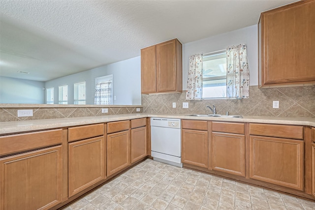 kitchen with dishwasher, decorative backsplash, and a healthy amount of sunlight