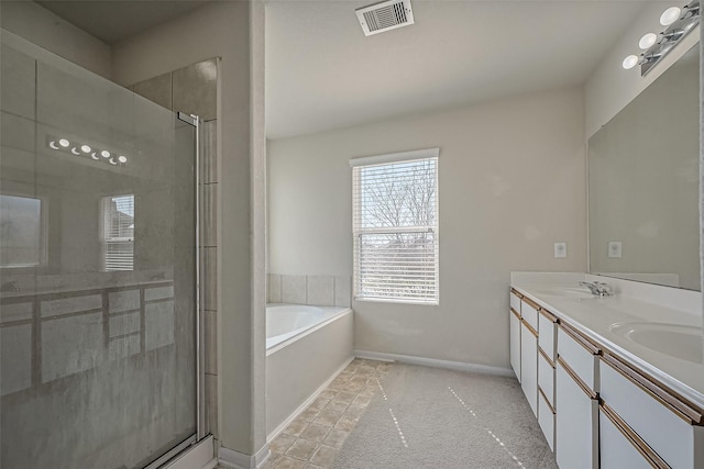 full bath featuring a bath, double vanity, a shower stall, and visible vents