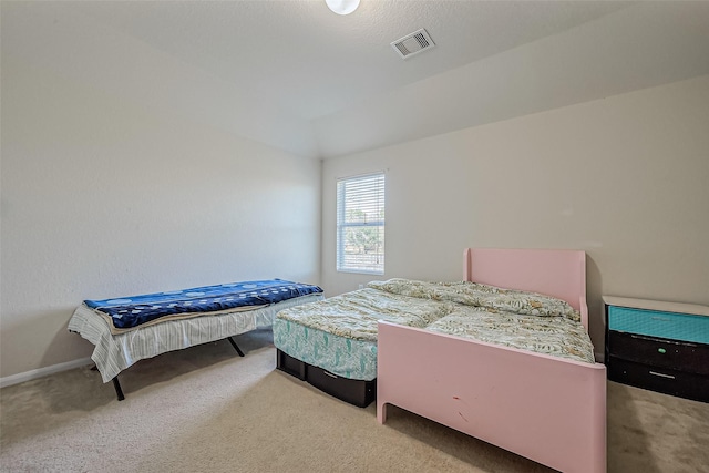 bedroom with carpet floors, baseboards, and visible vents