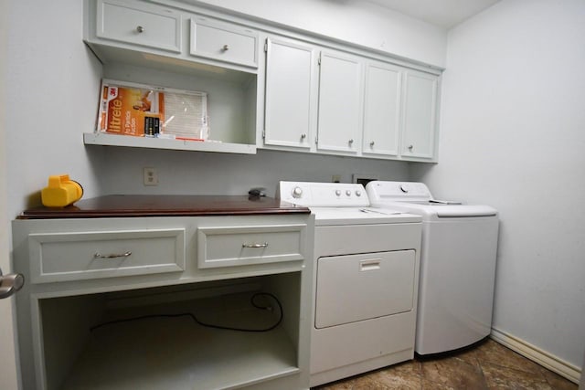 laundry room featuring cabinet space, washing machine and dryer, and baseboards