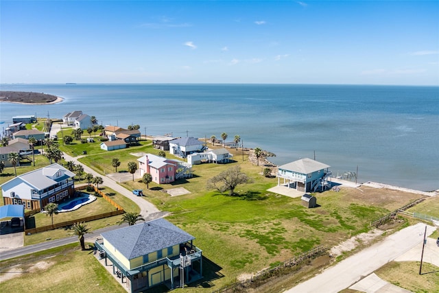 birds eye view of property with a water view and a residential view