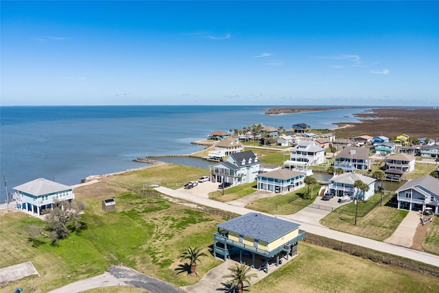 birds eye view of property featuring a water view and a residential view