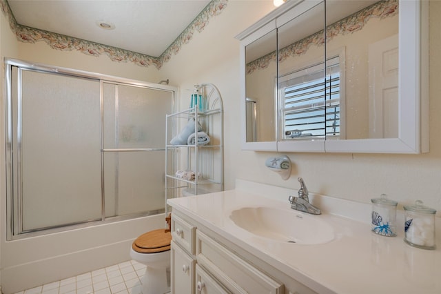 bathroom with enclosed tub / shower combo, vanity, toilet, and tile patterned floors