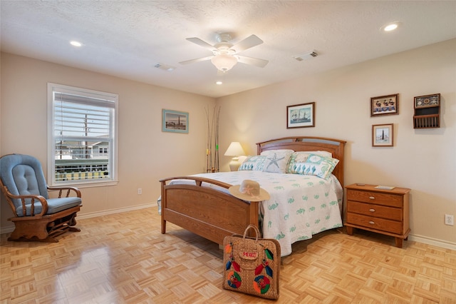 bedroom with baseboards, visible vents, a textured ceiling, and recessed lighting