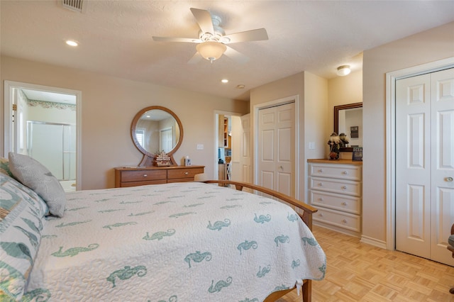 bedroom featuring two closets, recessed lighting, visible vents, connected bathroom, and ceiling fan