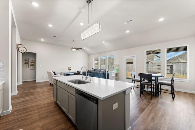 kitchen featuring a sink, open floor plan, light countertops, stainless steel dishwasher, and gray cabinets