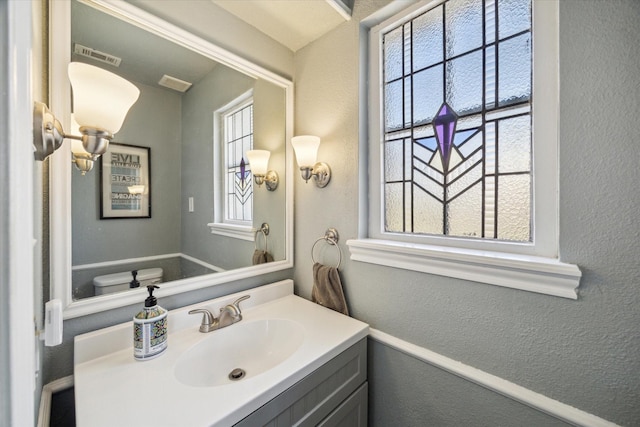 5502 Enchanted Timbers Dr, Humble, TX 77346 - bathroom with a textured wall and vanity