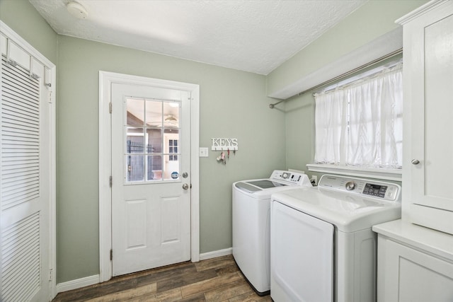 5502 Enchanted Timbers Dr, Humble, TX 77346 - laundry area featuring independent washer and dryer, dark wood-type flooring, baseboards, and a textured ceiling