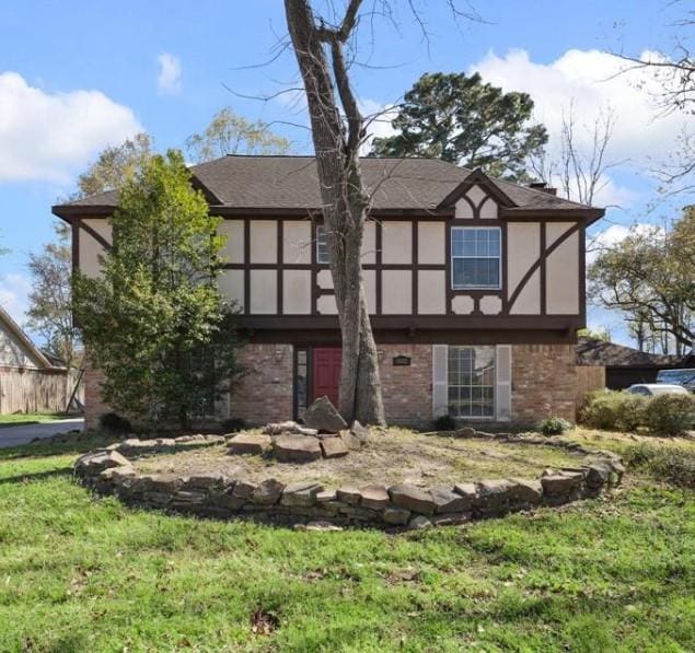 5502 Enchanted Timbers Dr, Humble, TX 77346 - view of front of property with brick siding and stucco siding