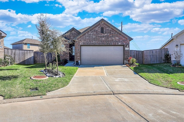 view of front of home featuring brick siding, a front yard, fence, a garage, and driveway