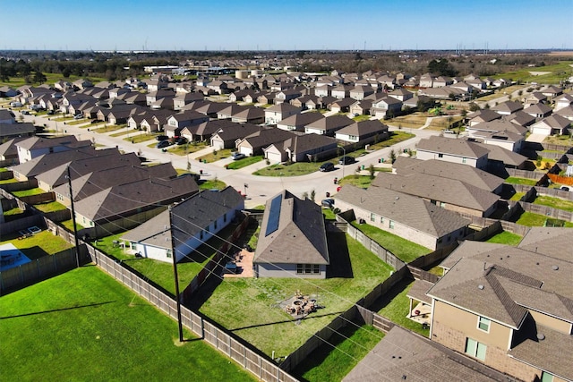 birds eye view of property with a residential view