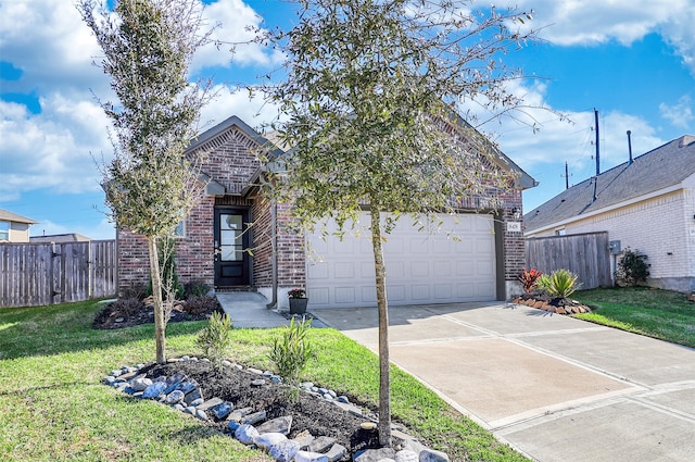 view of front of property featuring driveway, a front yard, fence, and brick siding