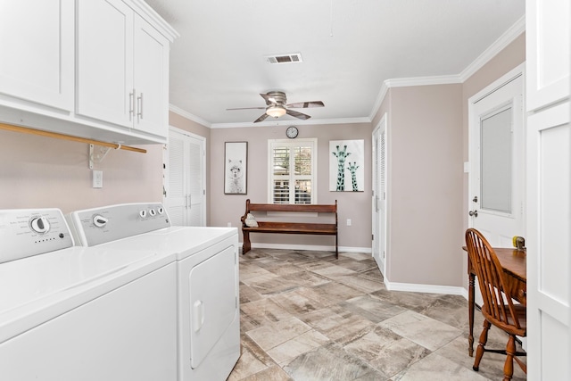 clothes washing area with washing machine and dryer, visible vents, baseboards, ornamental molding, and cabinet space
