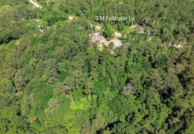 234 Feldspar Ln, Huntsville, TX 77340 - drone / aerial view with a wooded view
