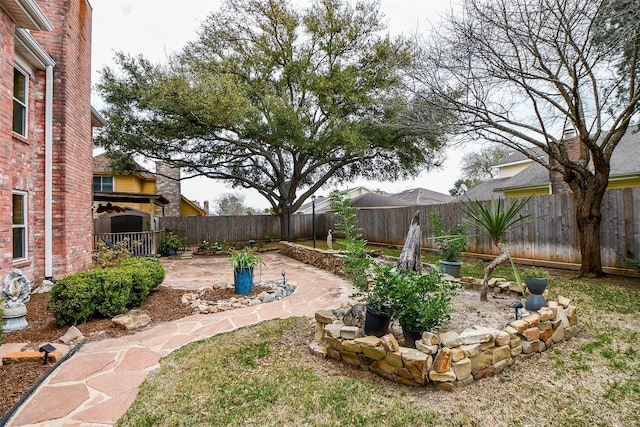 view of yard with a patio area and a fenced backyard