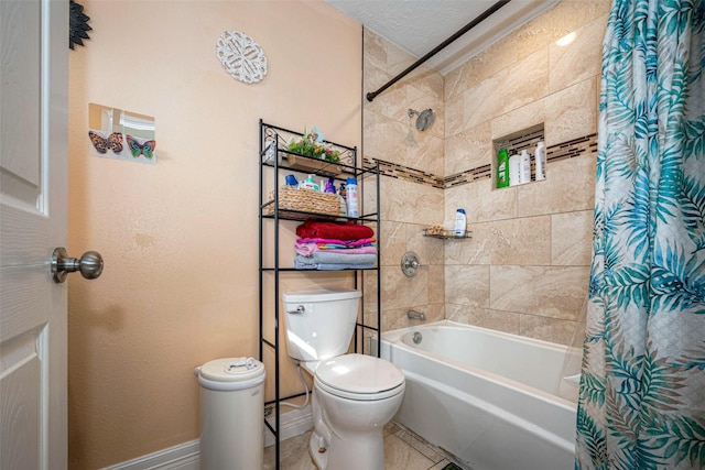 full bathroom with toilet, shower / bath combo, baseboards, and a textured ceiling