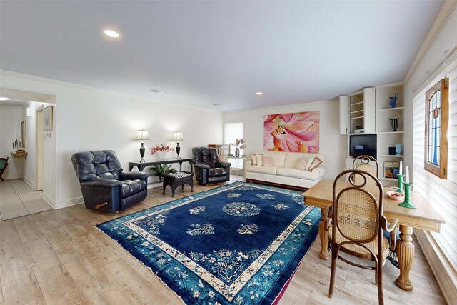 living area featuring recessed lighting, crown molding, and wood finished floors