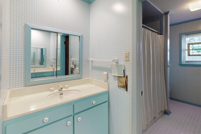 bathroom featuring tile patterned floors, vanity, curtained shower, and wallpapered walls